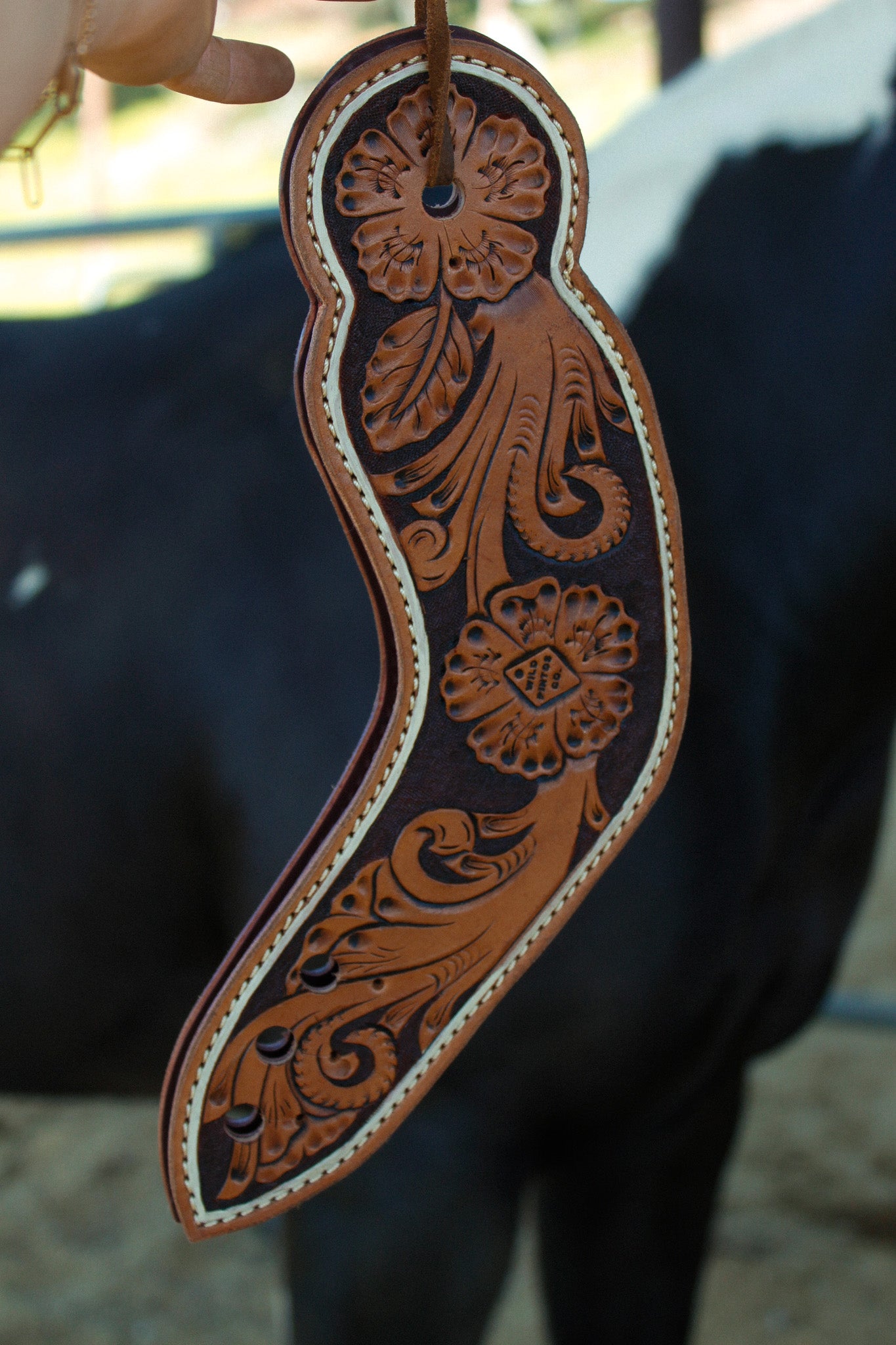 Decorative leather strap with intricate patterns 